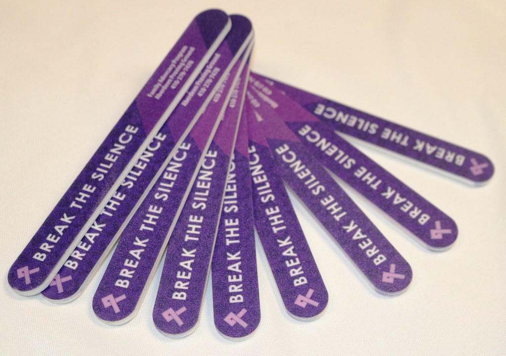 purple nail file/emery boards with "break the silence" printed on them