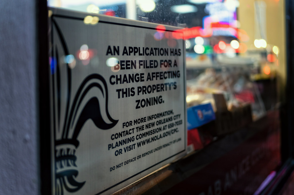 Sign reading "An application has been filed for a change affecting this property's zoning"