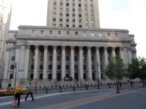 u.s. court house with street and taxi in front