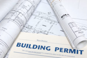 building permit on top of architectural building layout