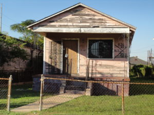 Abandoned home in New Orleans after Katrina, with the well-known code for a searched home