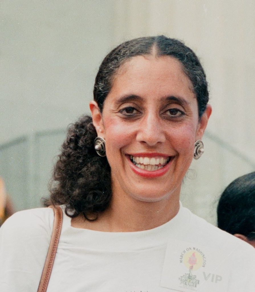 photo of lani guinier smiling with her hair tied back
