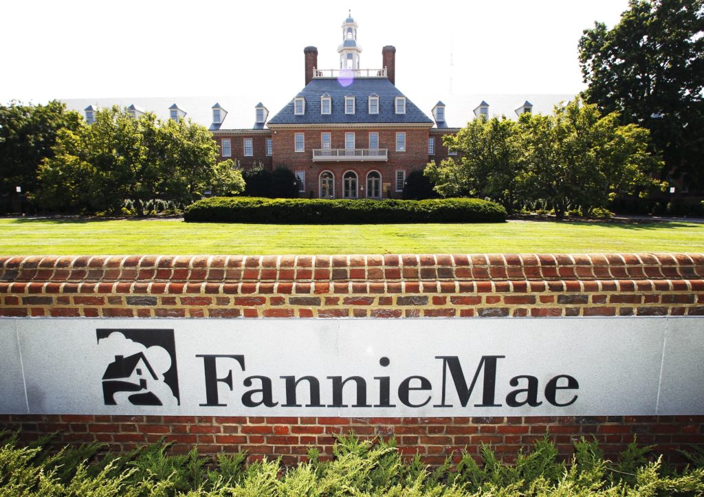 fannie mae headquarters in washington dc, big brick building in the background with large fannie mae sign in the foreground