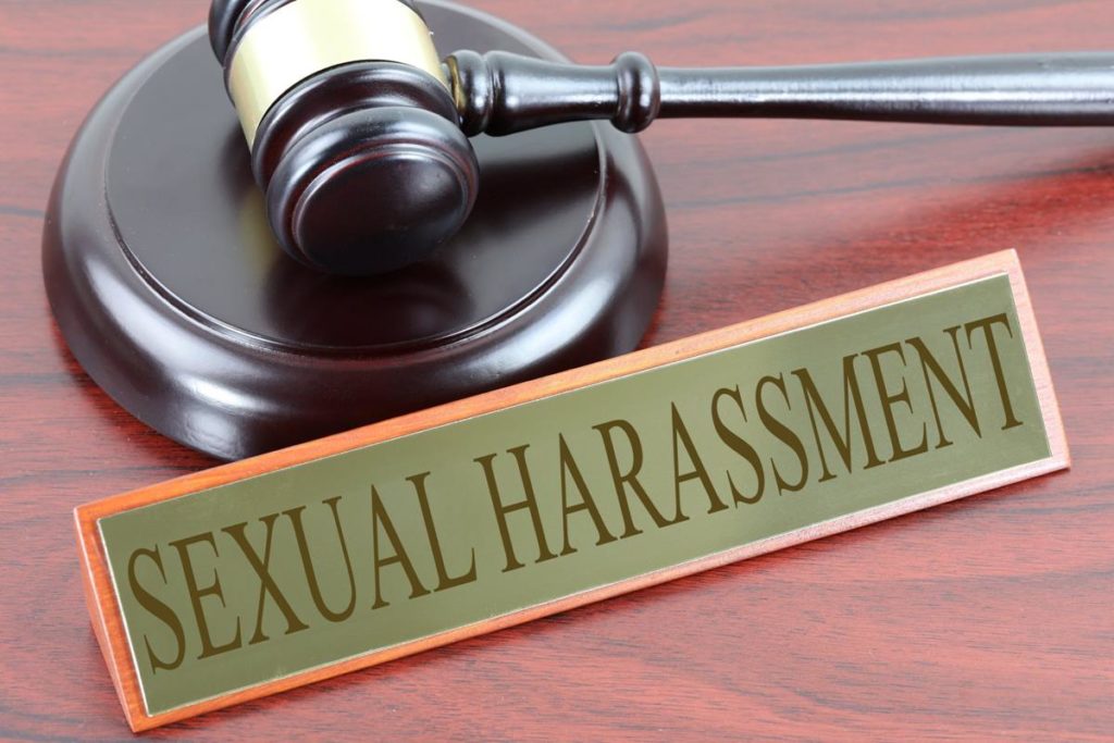 plaque that says "sexual harassment" in front of gavel