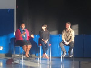 cashauna hill, lafhac's executive director, sitting on stools with two panelists at an event